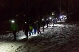 People outside in the dark.